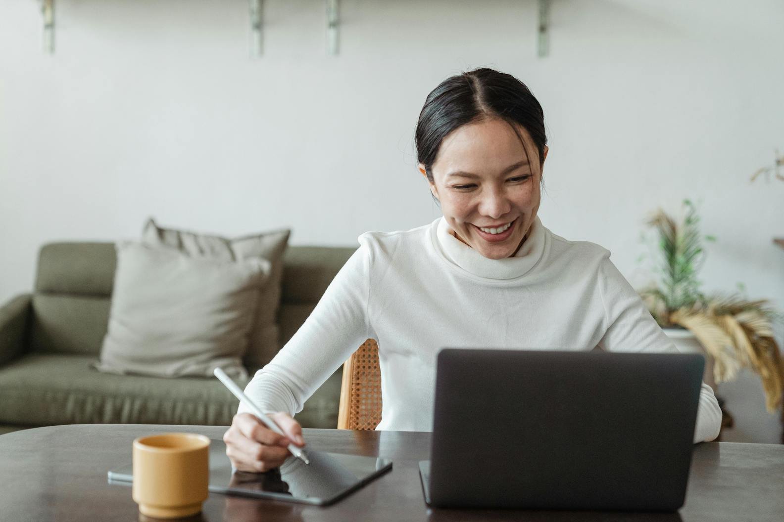 woman-sits-with-laptop-and-ipad-trying-online-coachinv